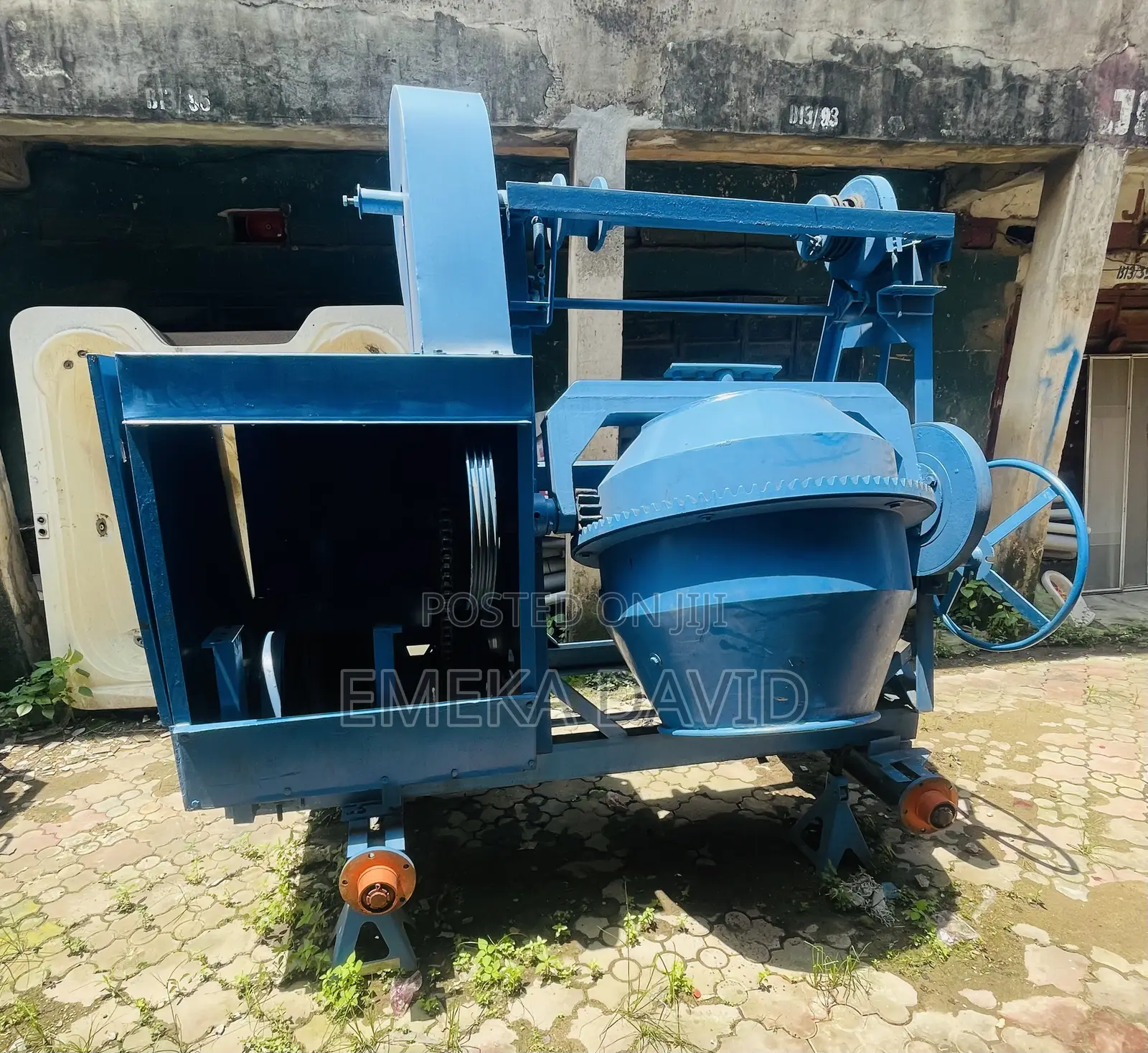 Industrial Machinery Concrete Mixer With Hoist and Pulley System.