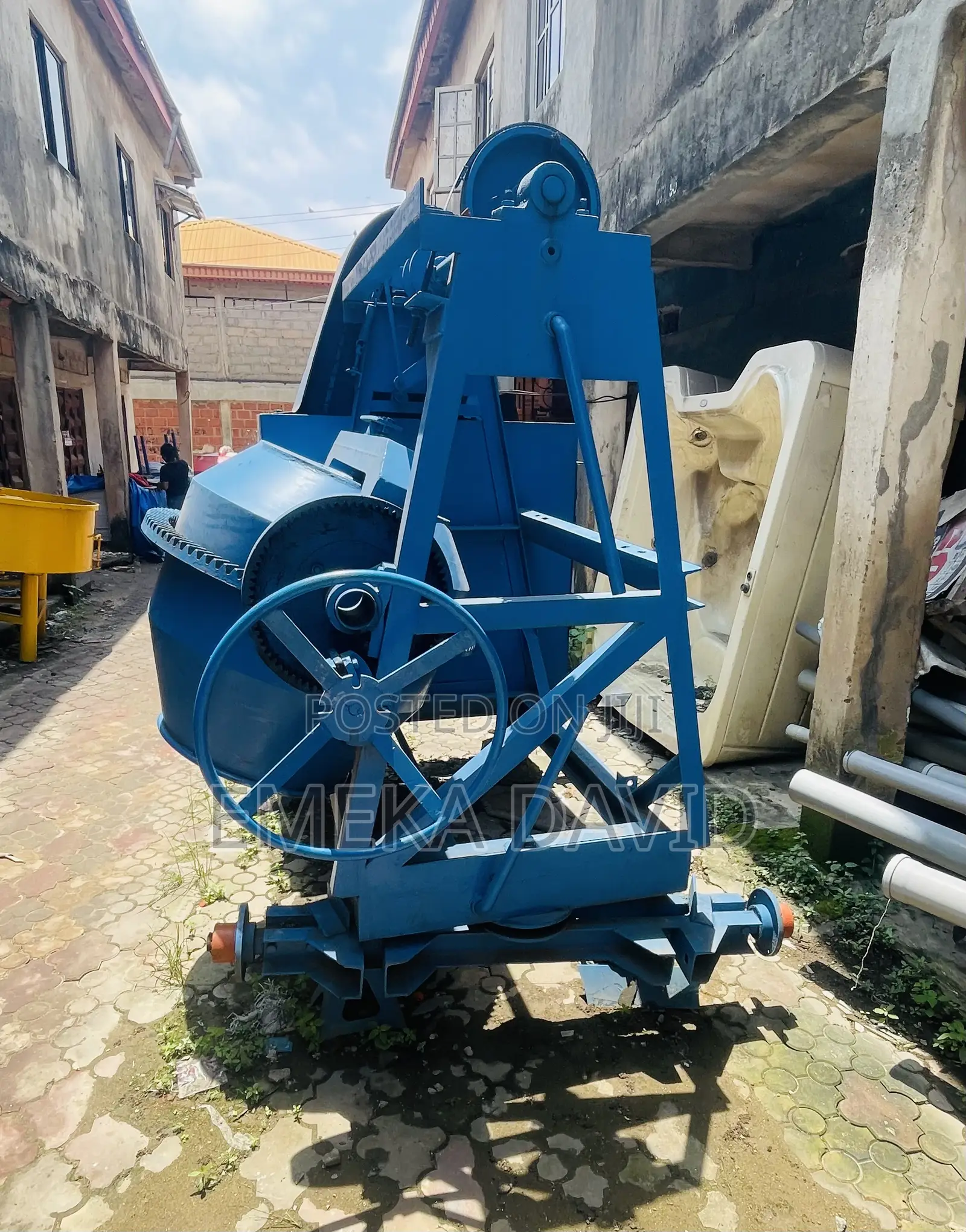 Industrial Machinery Concrete Mixer With Hoist and Pulley System.