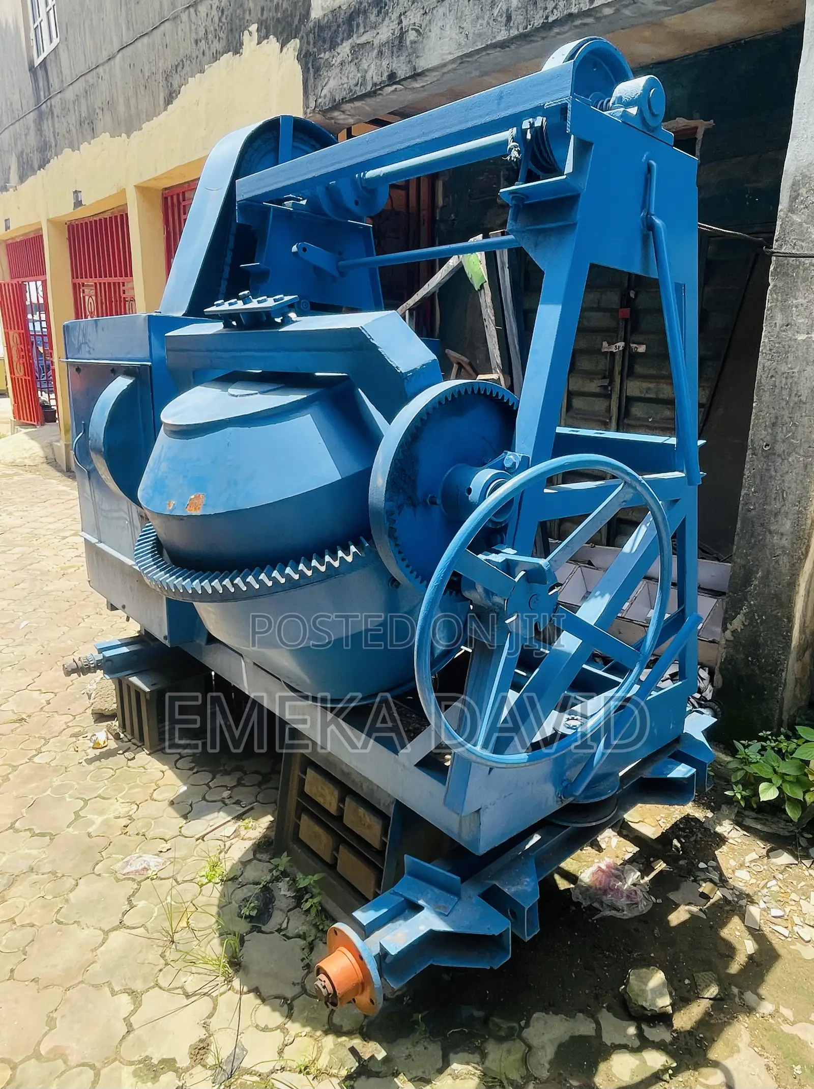 Industrial Machinery Concrete Mixer With Hoist and Pulley System.
