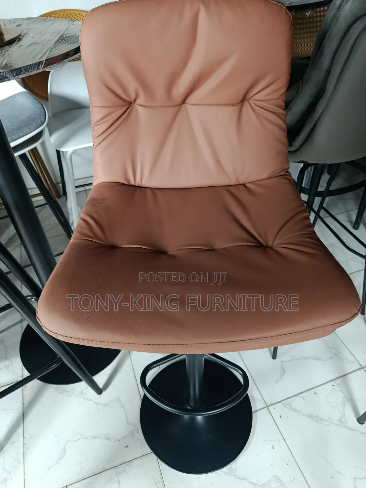 Modern Hydraulic Bar Stool Features a Brown Faux Leather.