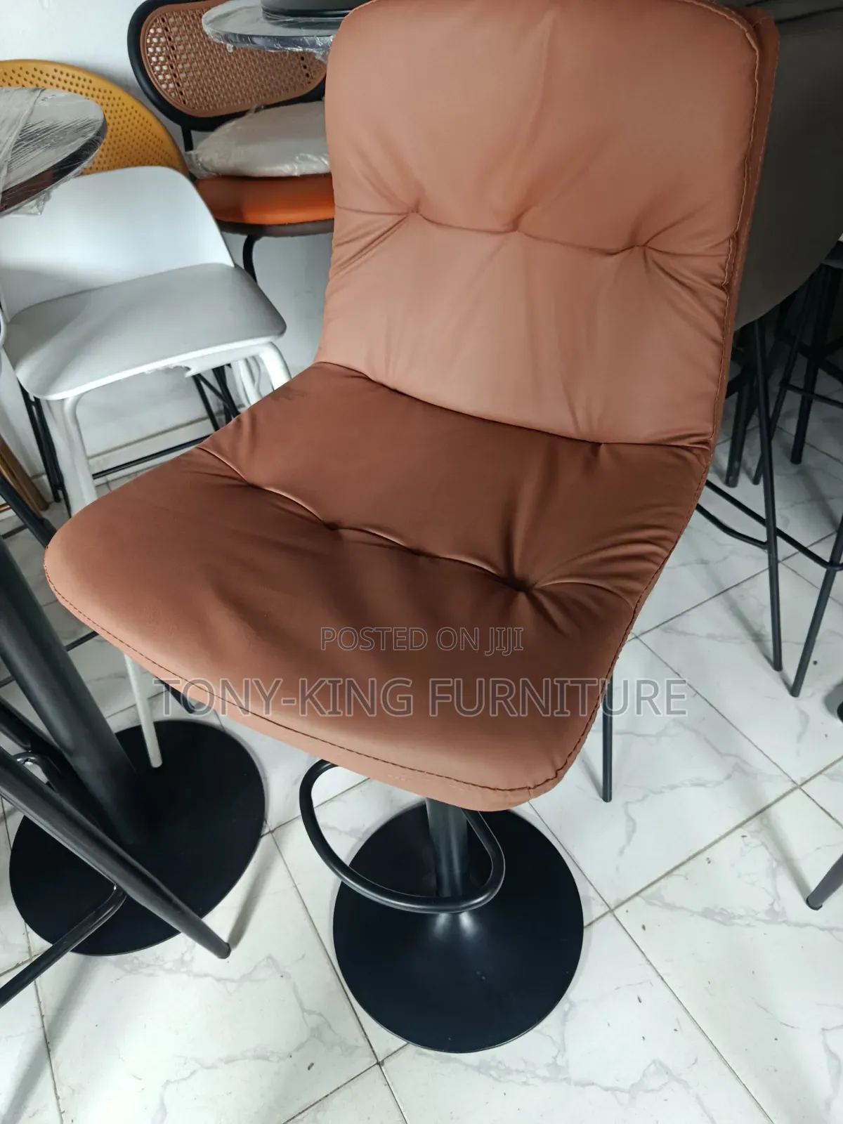 Modern Hydraulic Bar Stool Features a Brown Faux Leather.