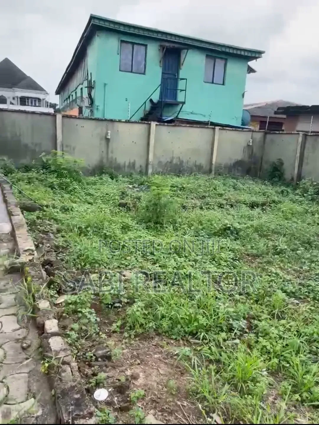 Half Plot in a Mini Estate at JokeAyo | Just a Building to Tarred Road