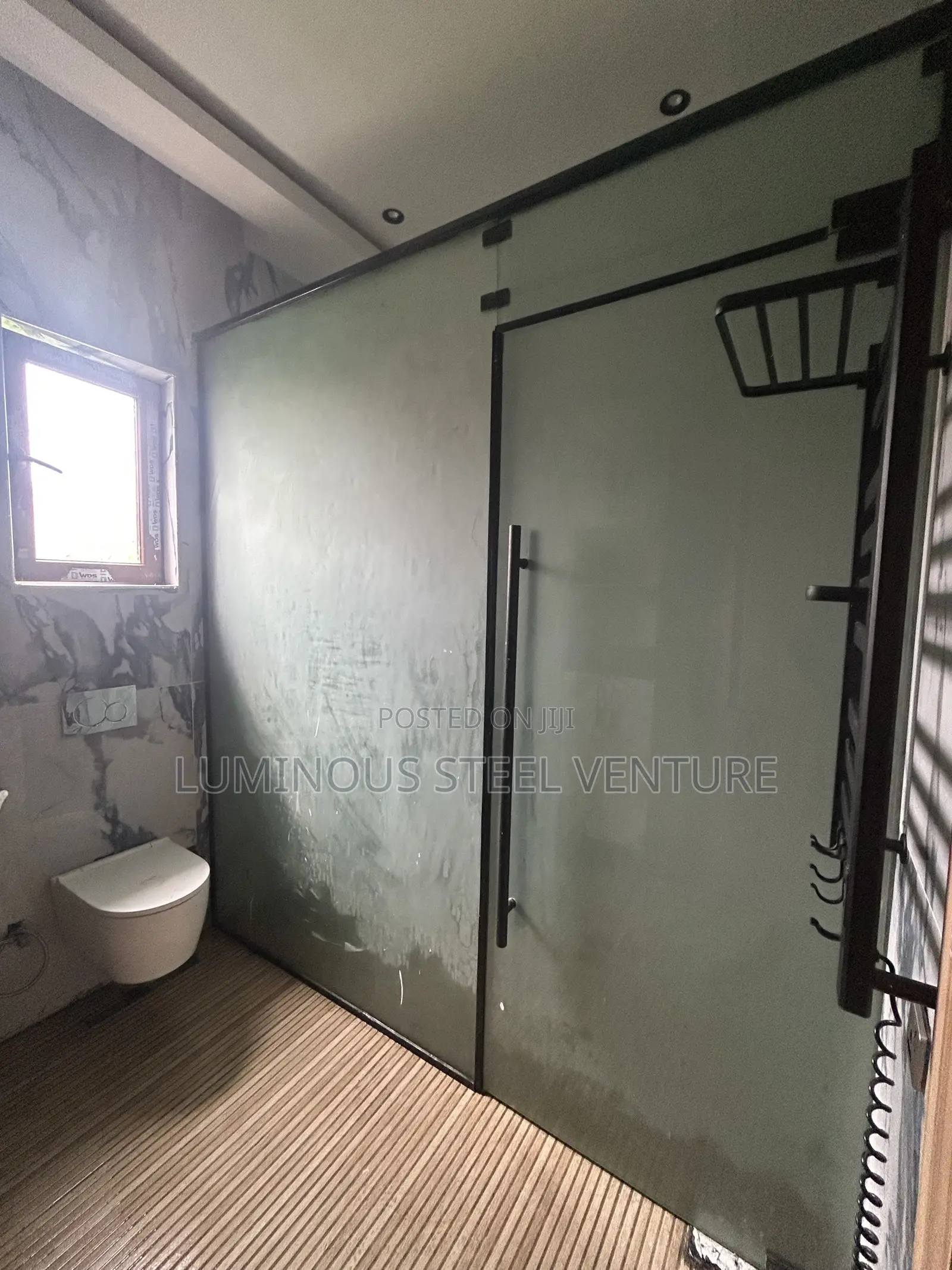 12 Mm of Frosted Rust-Proof CNG Glass With a Black Profile