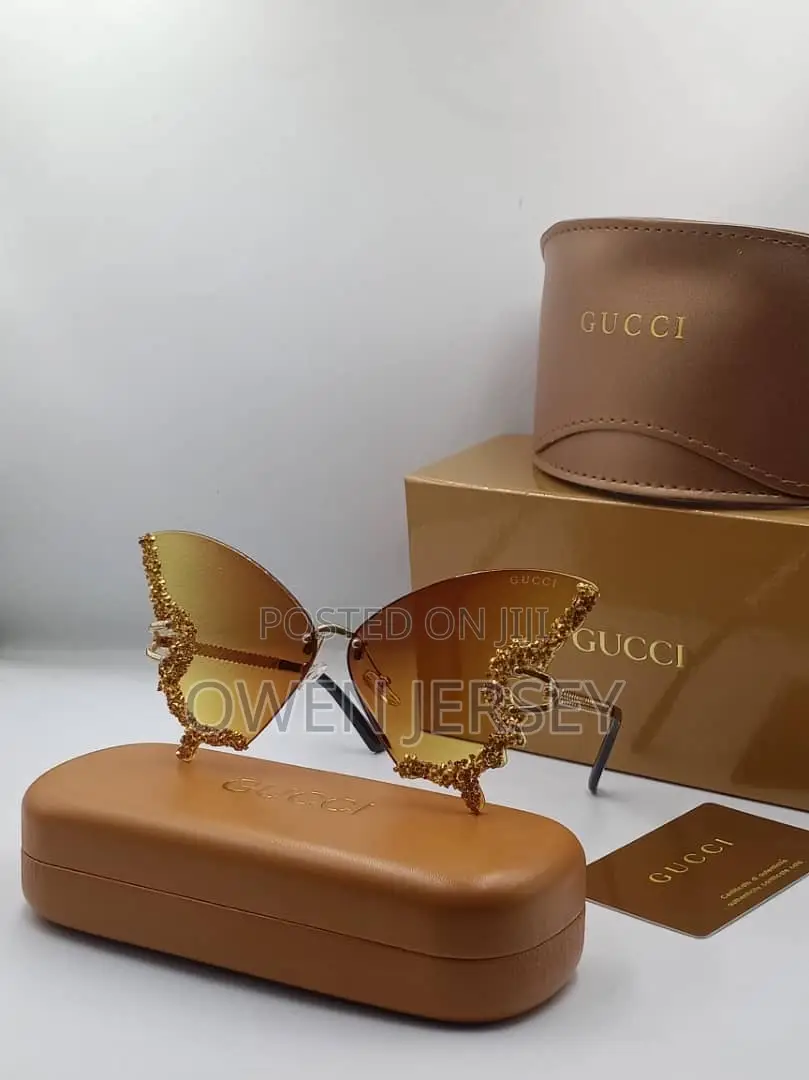 Luxury Gucci Crystal-Embellished Butterfly Sunglasses.