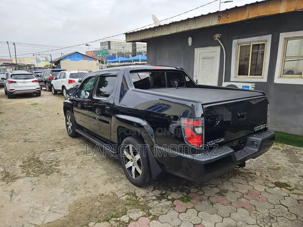 Honda Ridgeline RTL 4dr Crew Cab 4WD SB w/Leather (3.5L 6cyl 5A) 2014