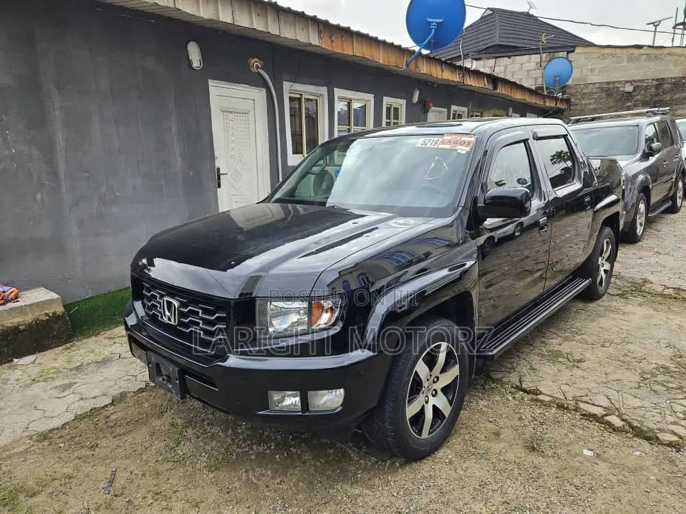 Honda Ridgeline RTL 4dr Crew Cab 4WD SB w/Leather (3.5L 6cyl 5A) 2014