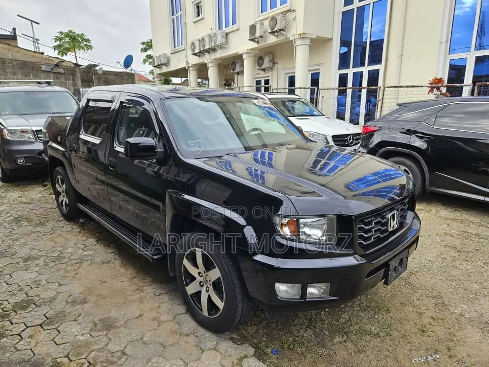 Honda Ridgeline RTL 4dr Crew Cab 4WD SB w/Leather (3.5L 6cyl 5A) 2014