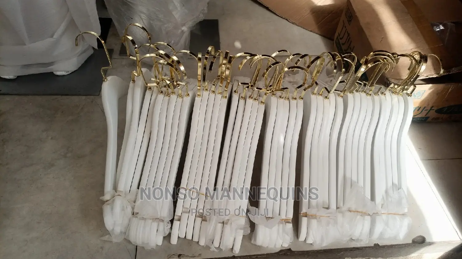 White and Gold Wooden Clothes Hangers