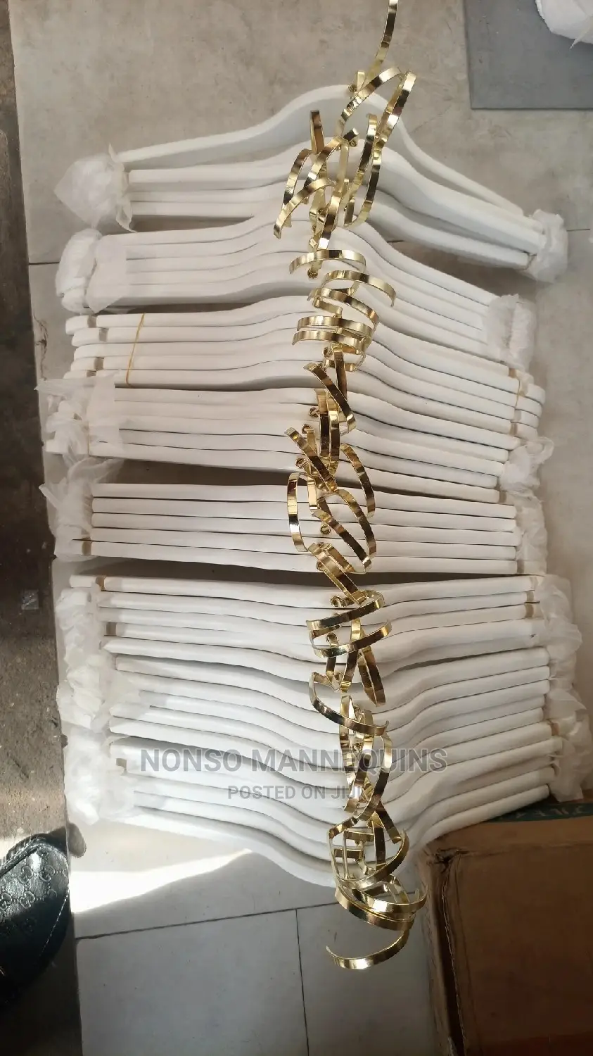 White and Gold Wooden Clothes Hangers