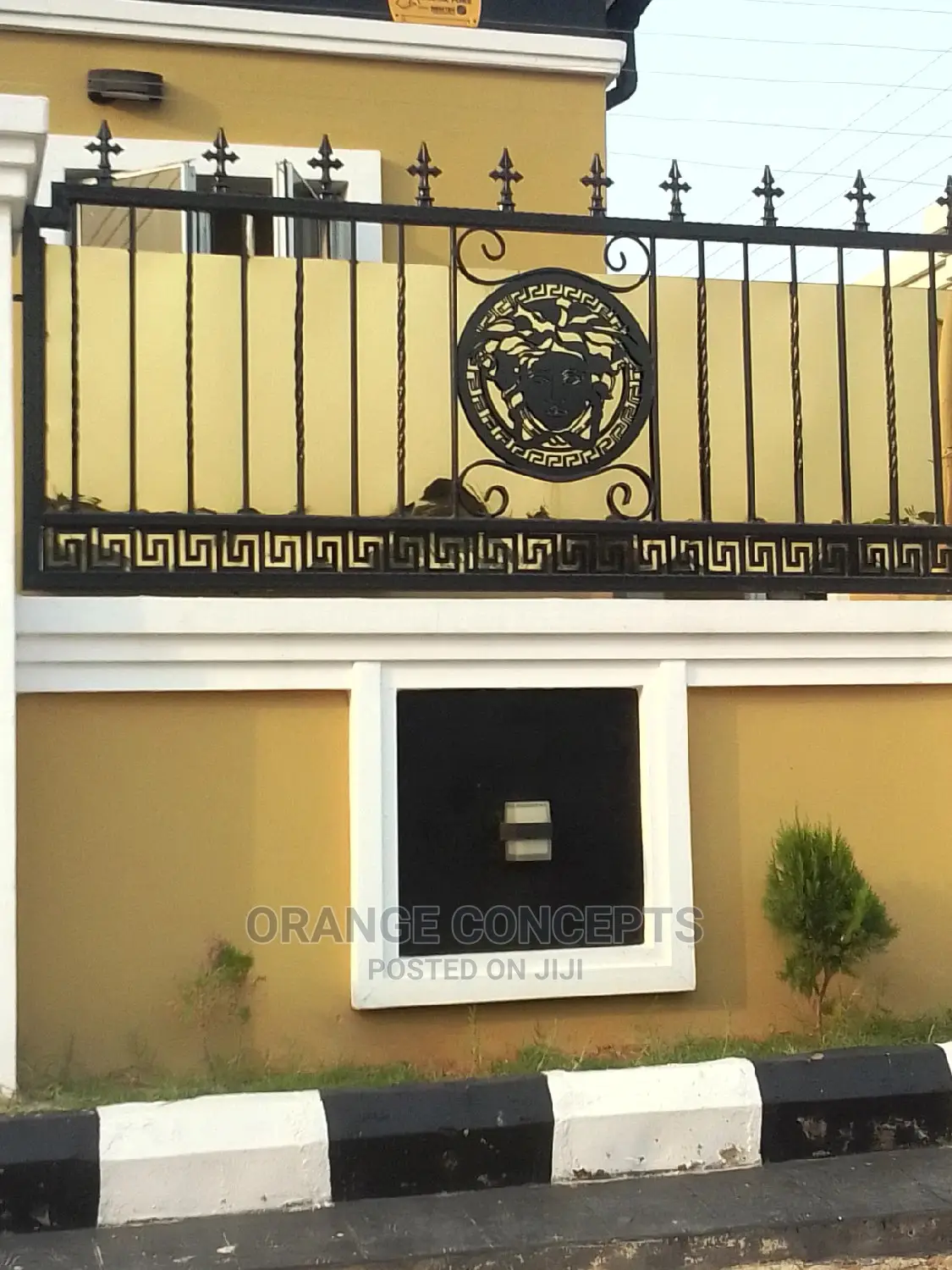 Wrought Iron Gate With Gold Plate