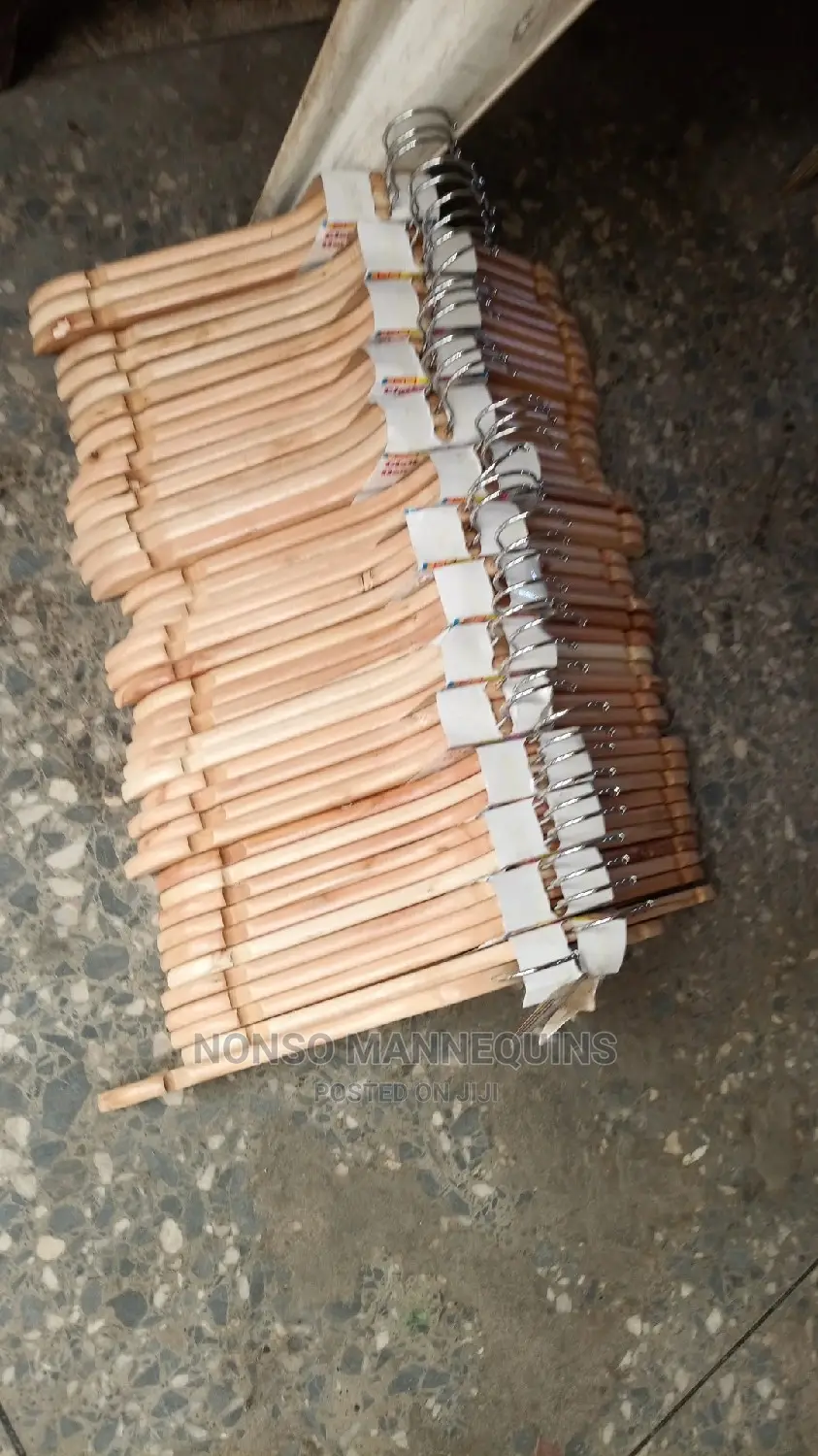 Clean Neat Wooden Clothes Hangees For Displaying Clothes