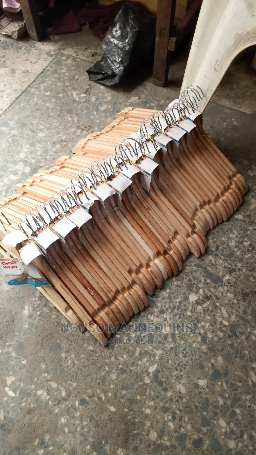 Clean Neat Wooden Clothes Hangees For Displaying Clothes
