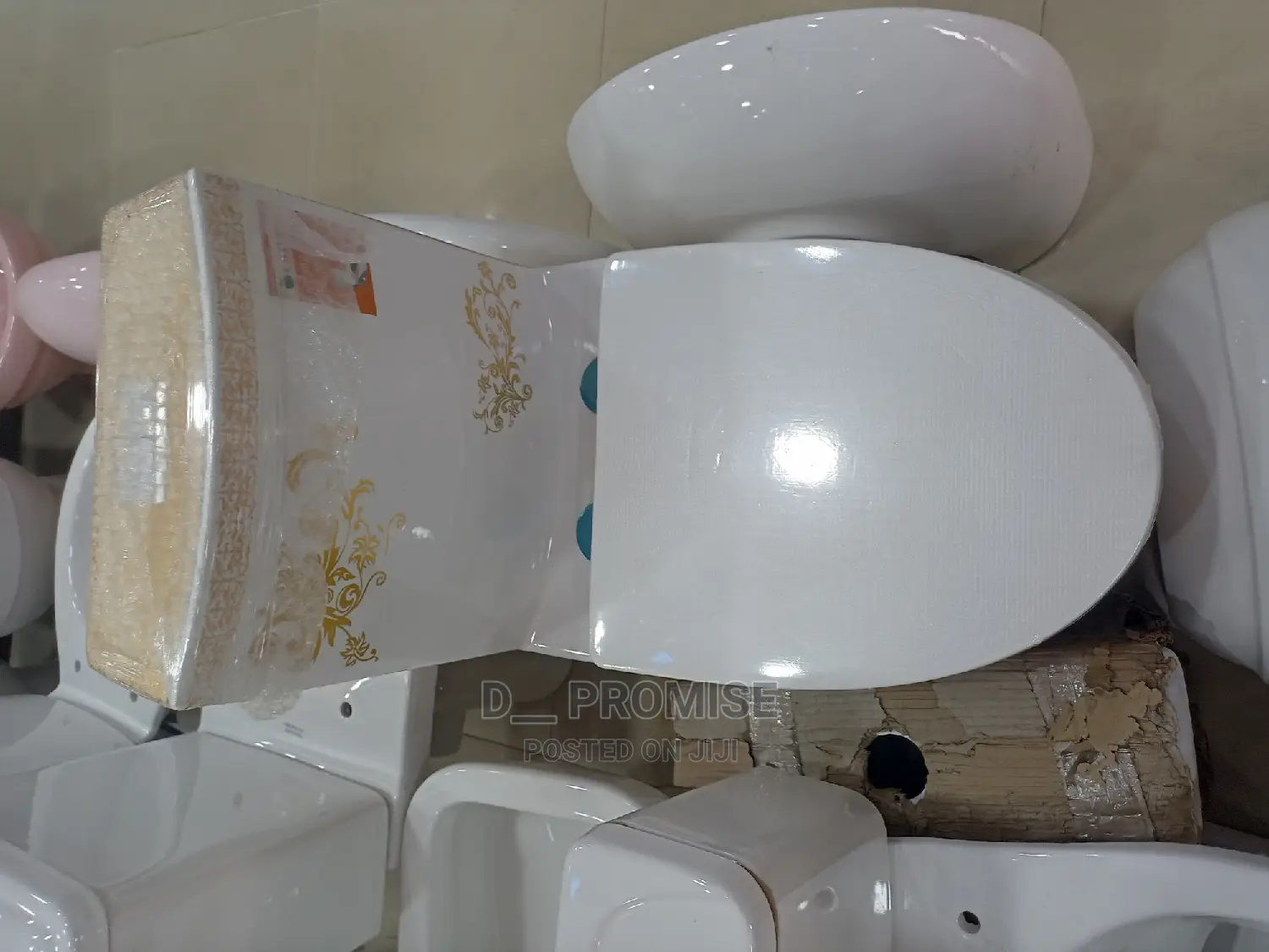 White Water Closet With Design of Gold