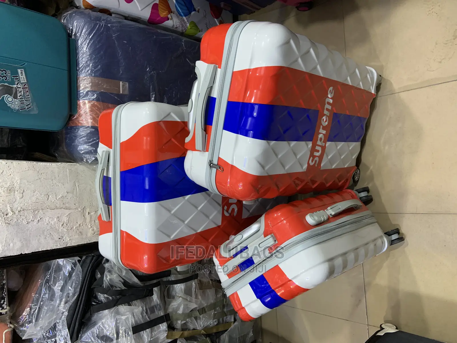 Set of 3 Multicolored Plastic Traveling Luggage