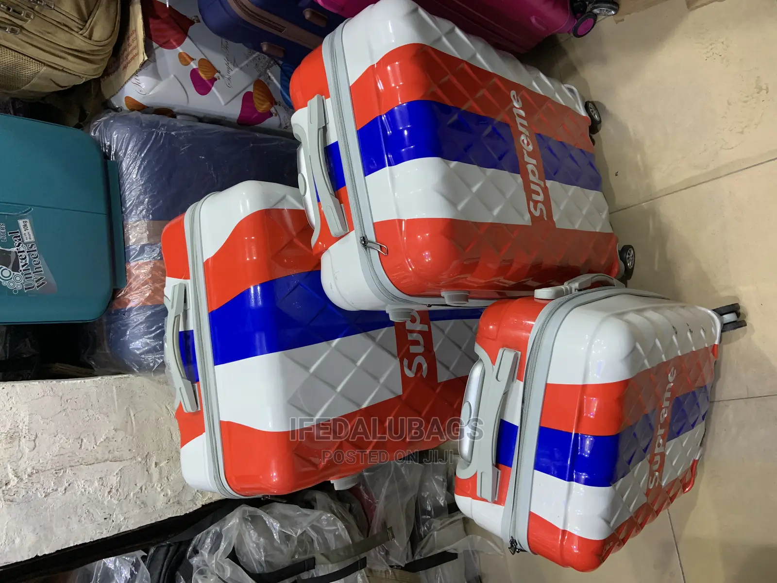 Set of 3 Multicolored Plastic Traveling Luggage