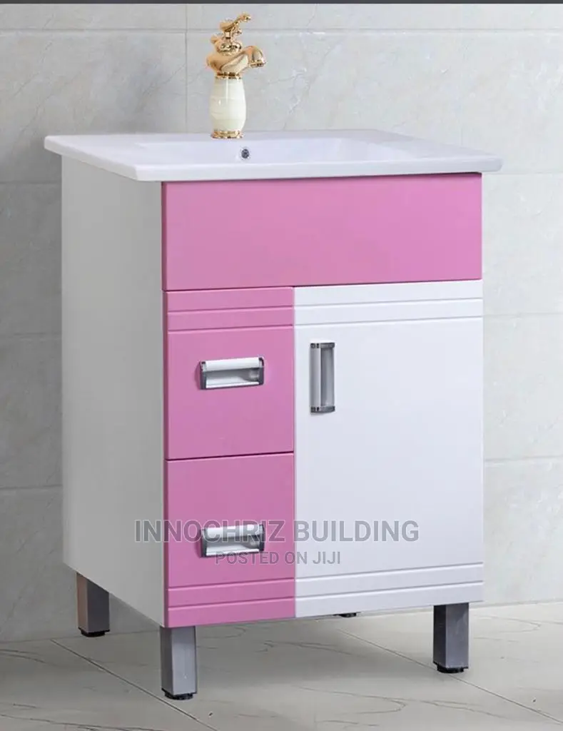 Pink And White Cabinet And Basin