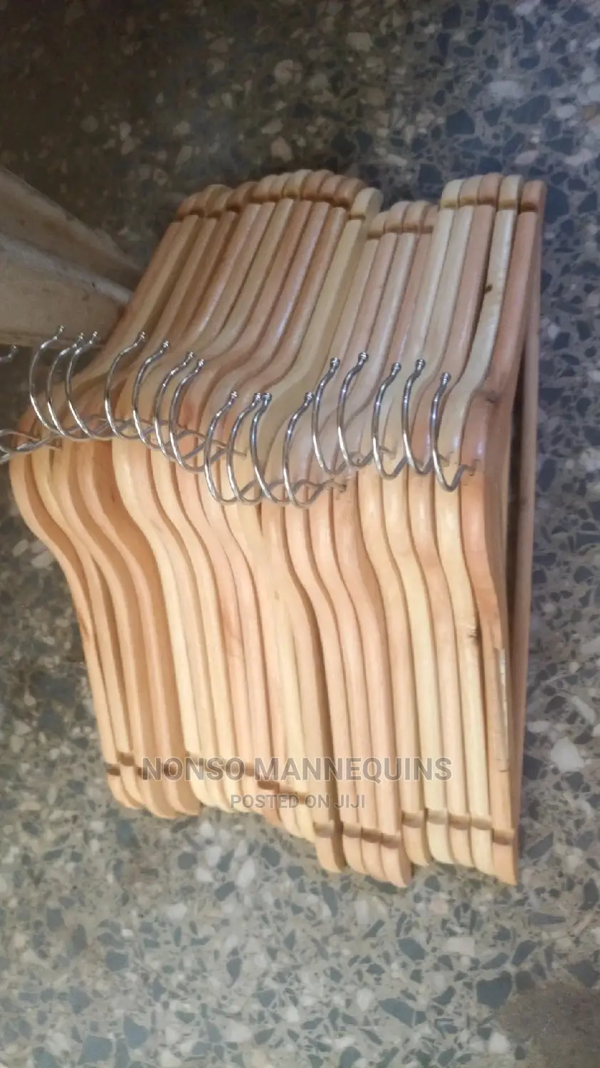 Clean And Neat Seta Of Wooden Clothes Hangers