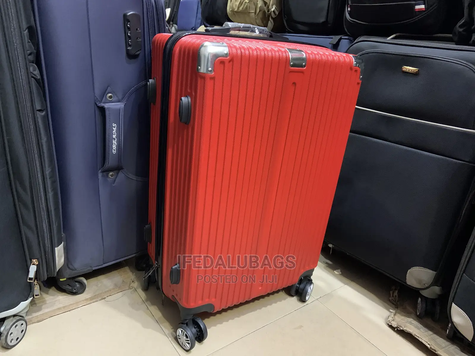 Medium Size Red Plastic Traveling Luggage