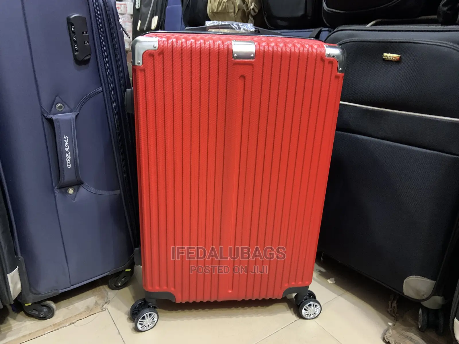 Medium Size Red Plastic Traveling Luggage