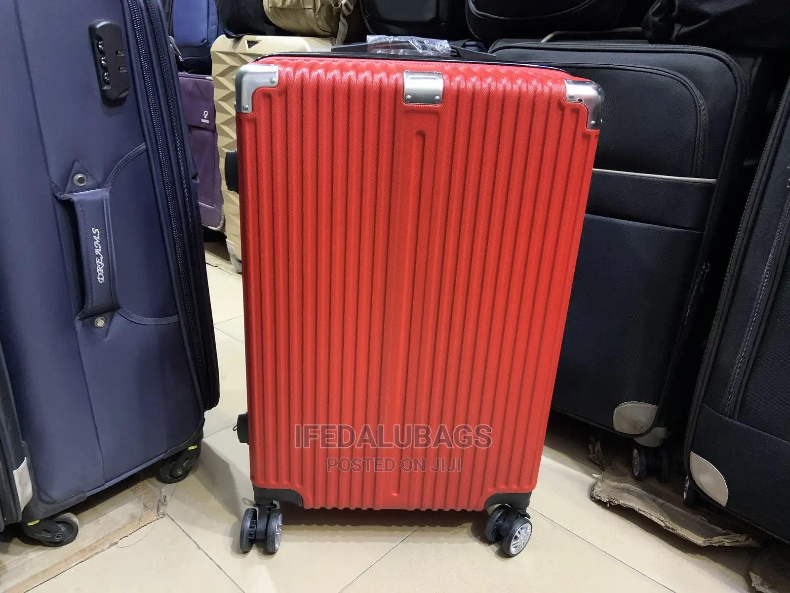 Medium Size Red Plastic Traveling Luggage