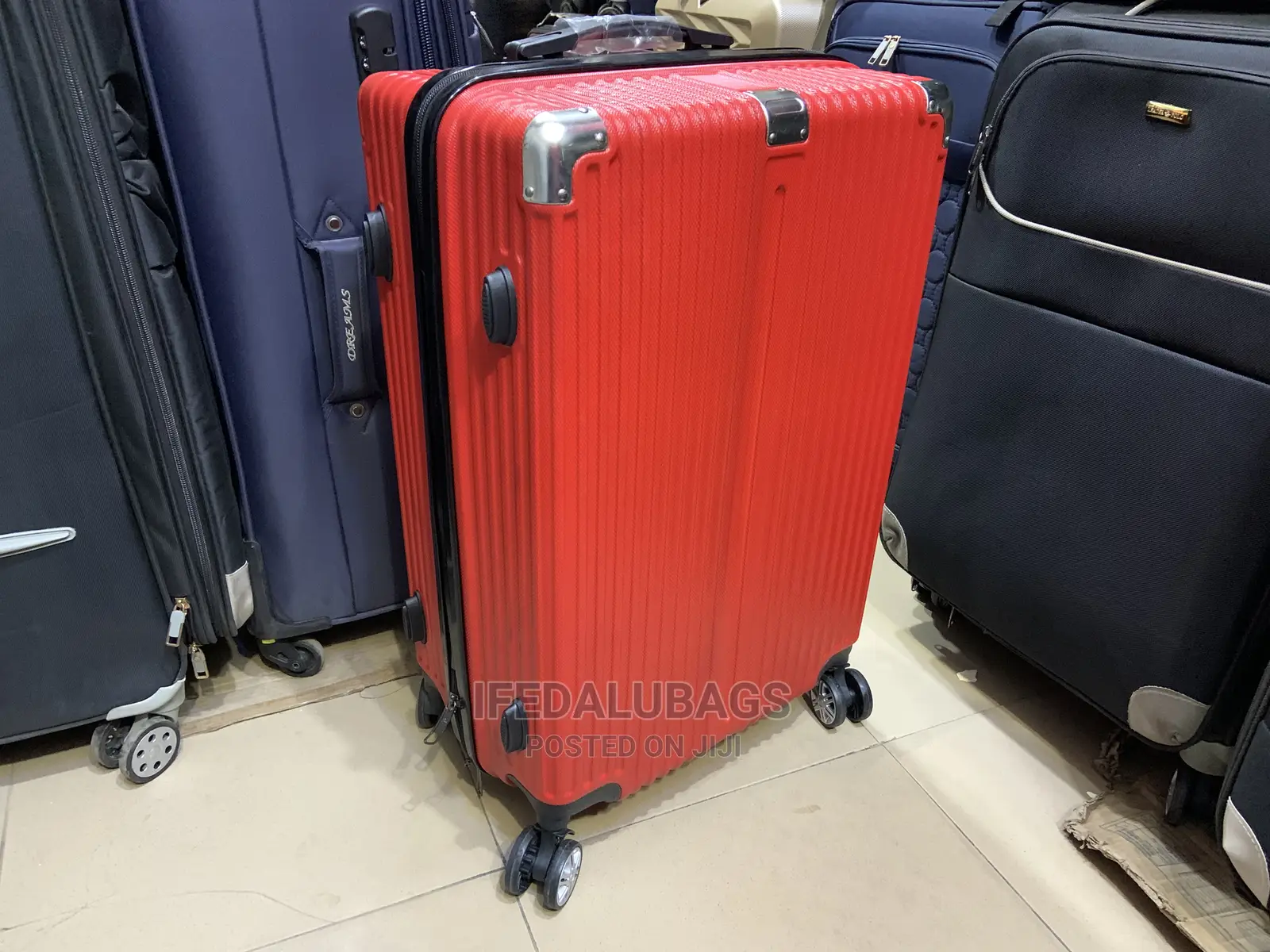 Medium Size Red Plastic Traveling Luggage