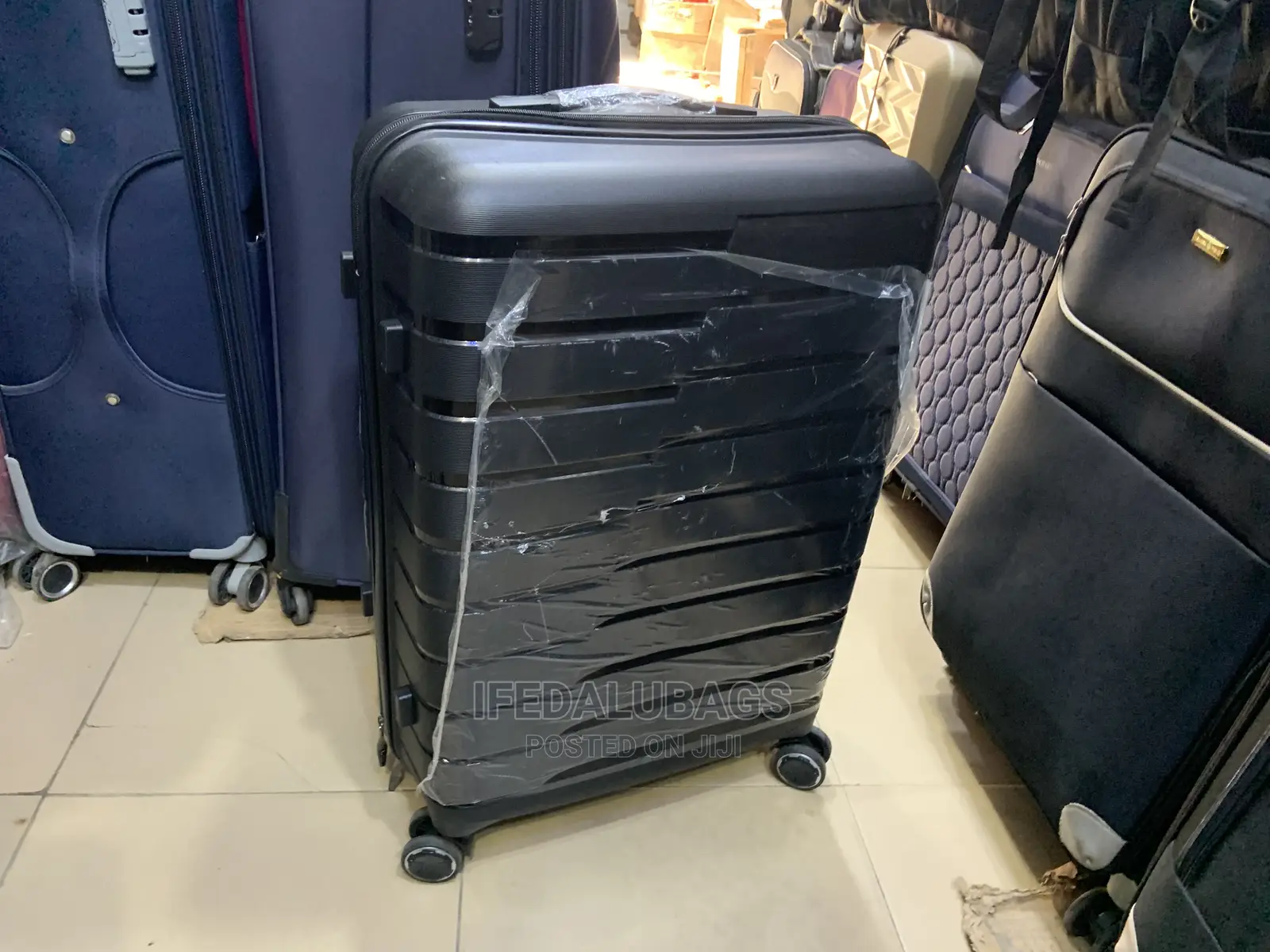 Medium Size Black Imported Quality Plastic Travelingluggage