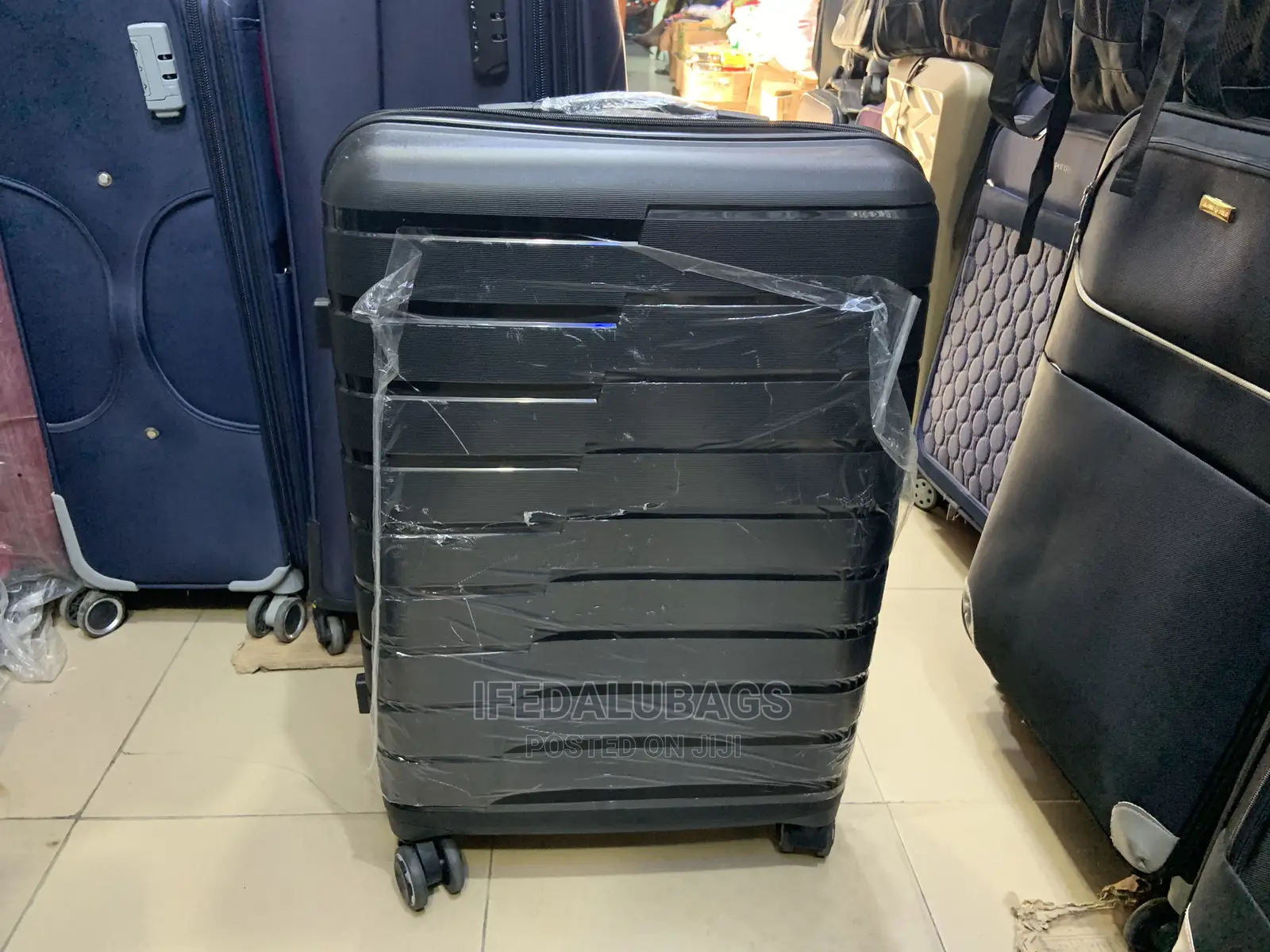 Medium Size Black Imported Quality Plastic Travelingluggage