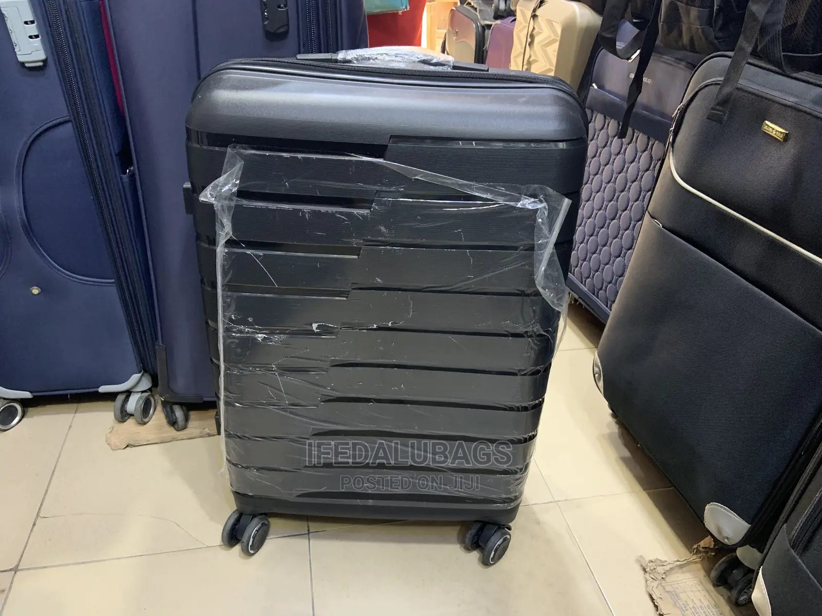 Medium Size Black Imported Quality Plastic Travelingluggage