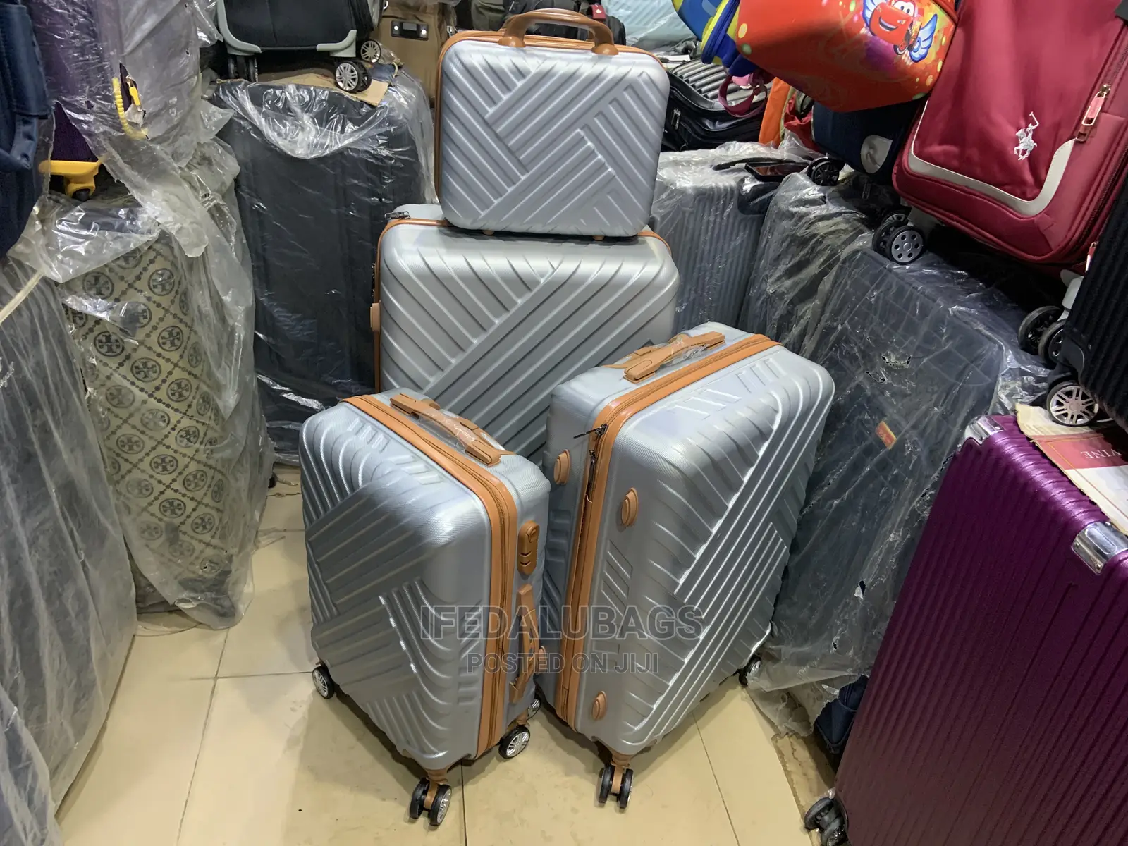 Set of Quality Silver Plastic Traveling Luggage With Kit
