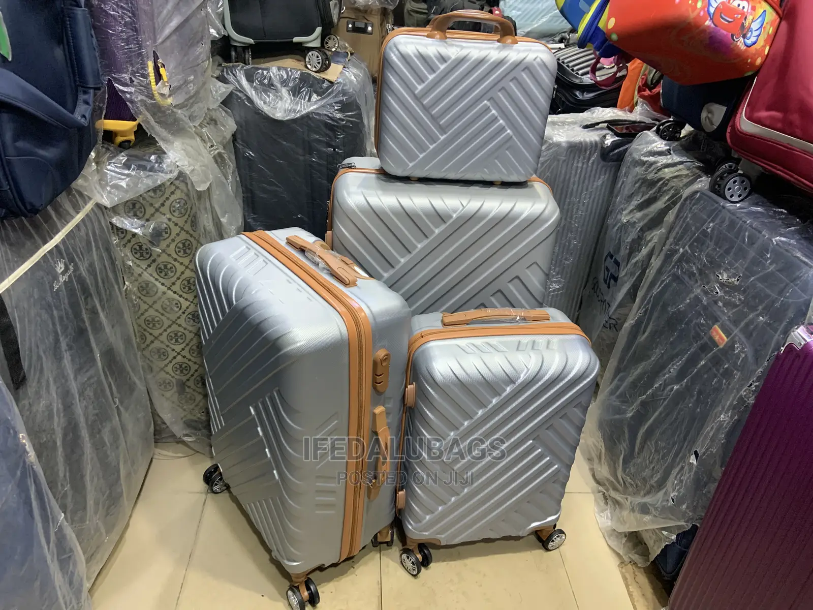 Set of Quality Silver Plastic Traveling Luggage With Kit