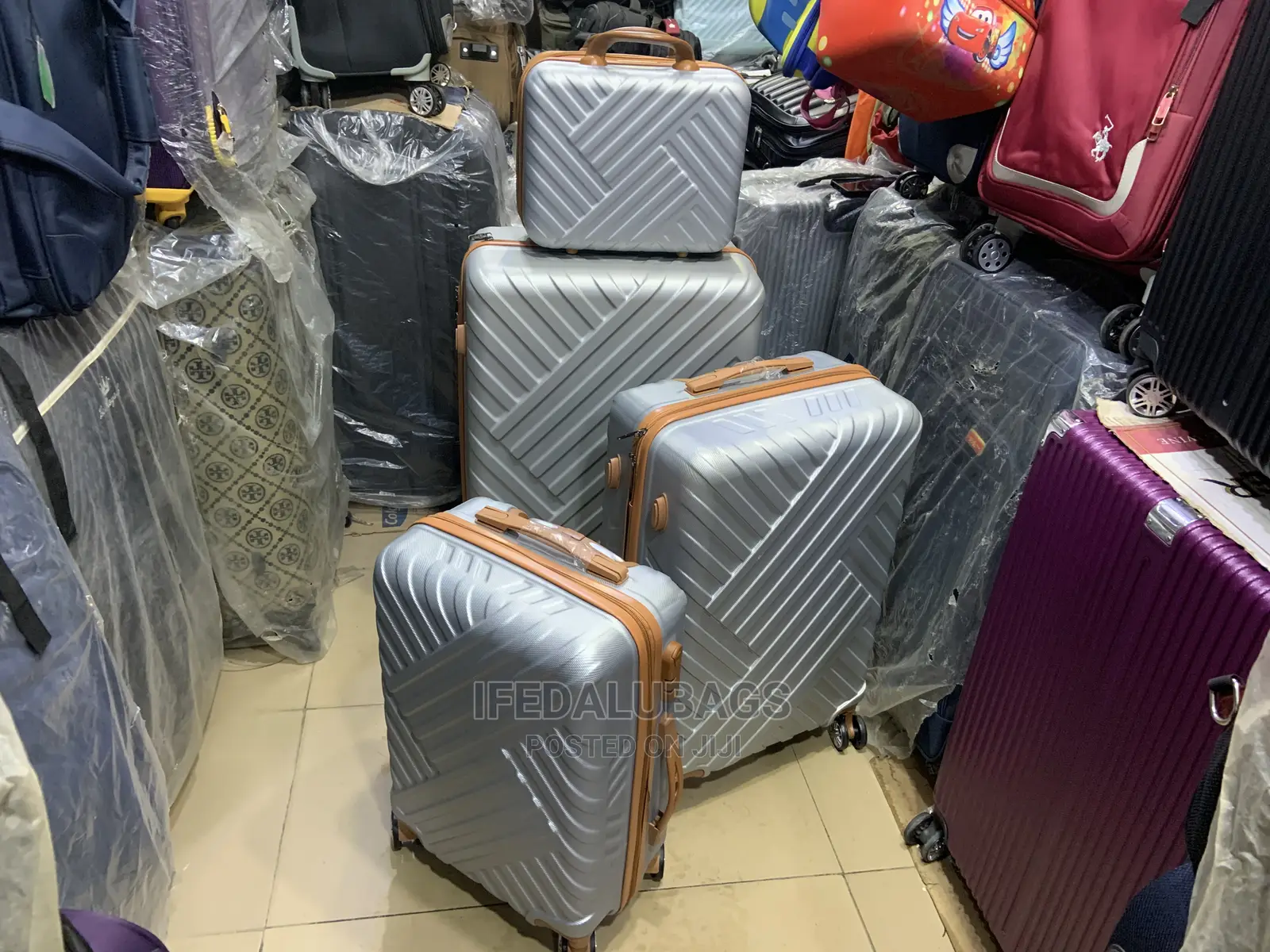 Set of Quality Silver Plastic Traveling Luggage With Kit