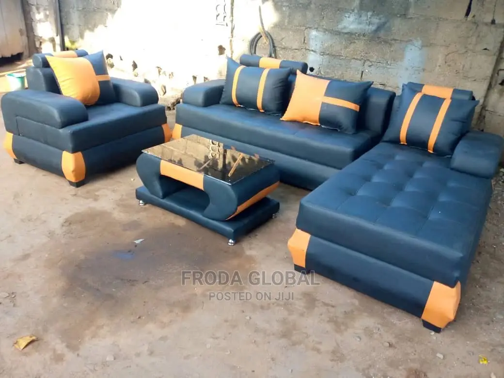 L-Shaped Sofa With Single Chair and Table. Leather Couch