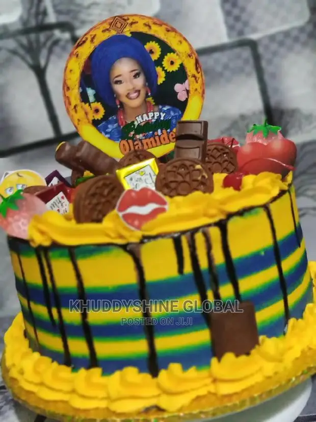 Yellow and Blue With Chocolates Topping Birthday Cakes