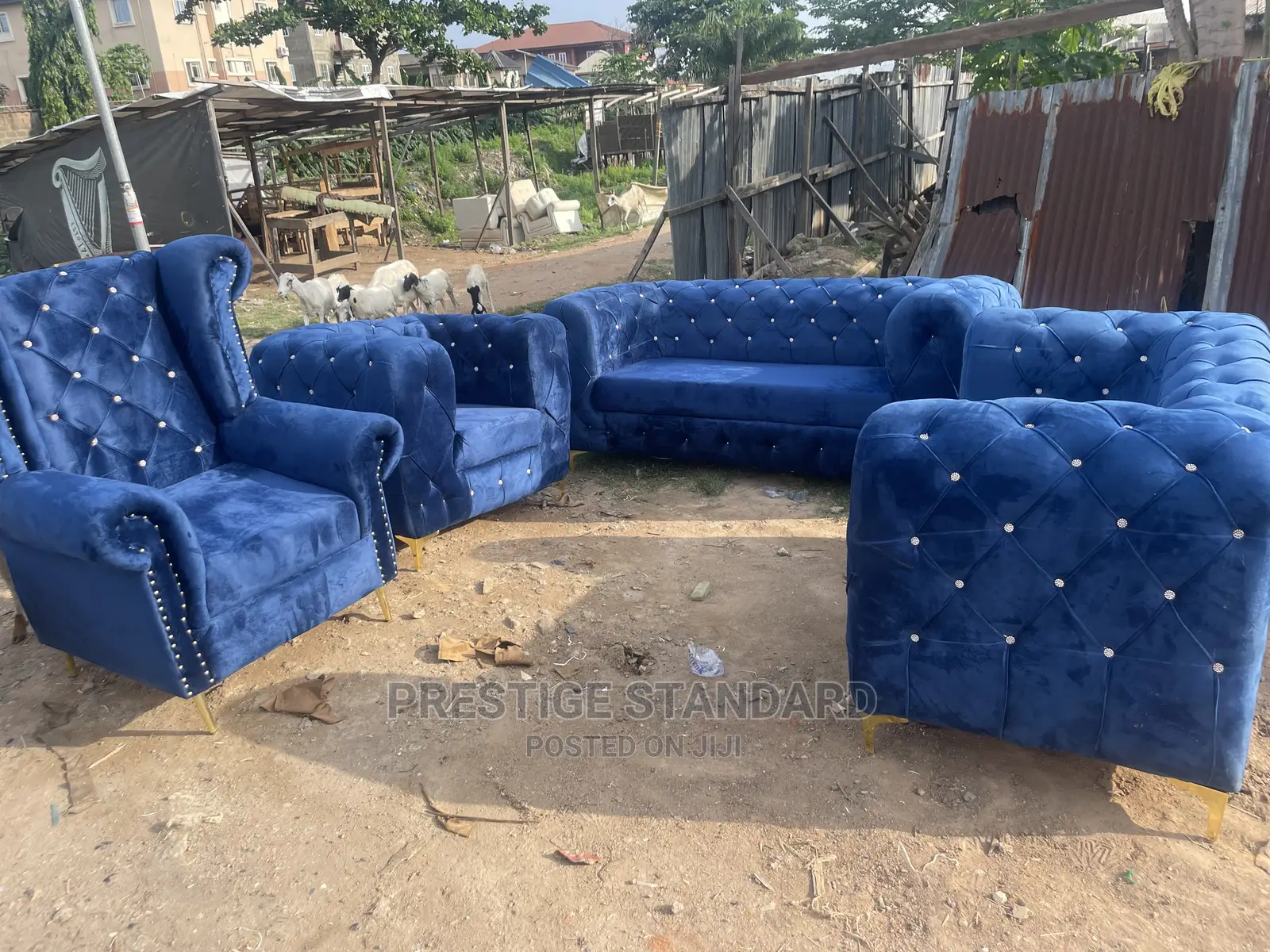 A Standard Chesterfield Sofa With Royal Chair
