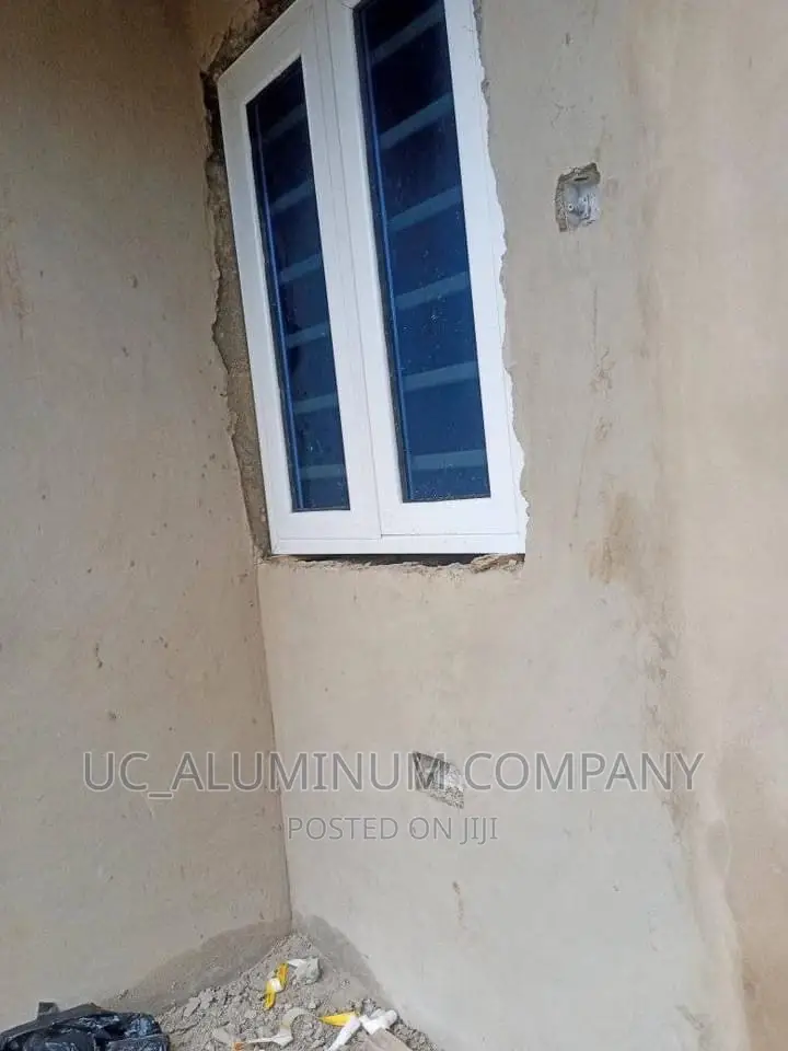 White Casement Window With Burglary and Net
