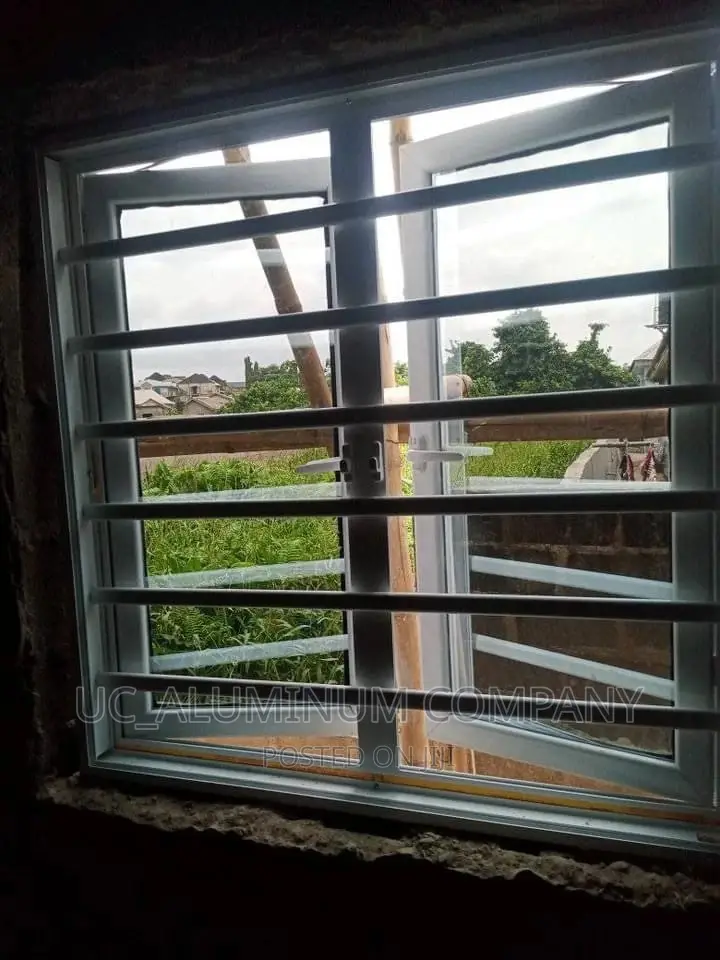 White Casement Window With Burglary and Net
