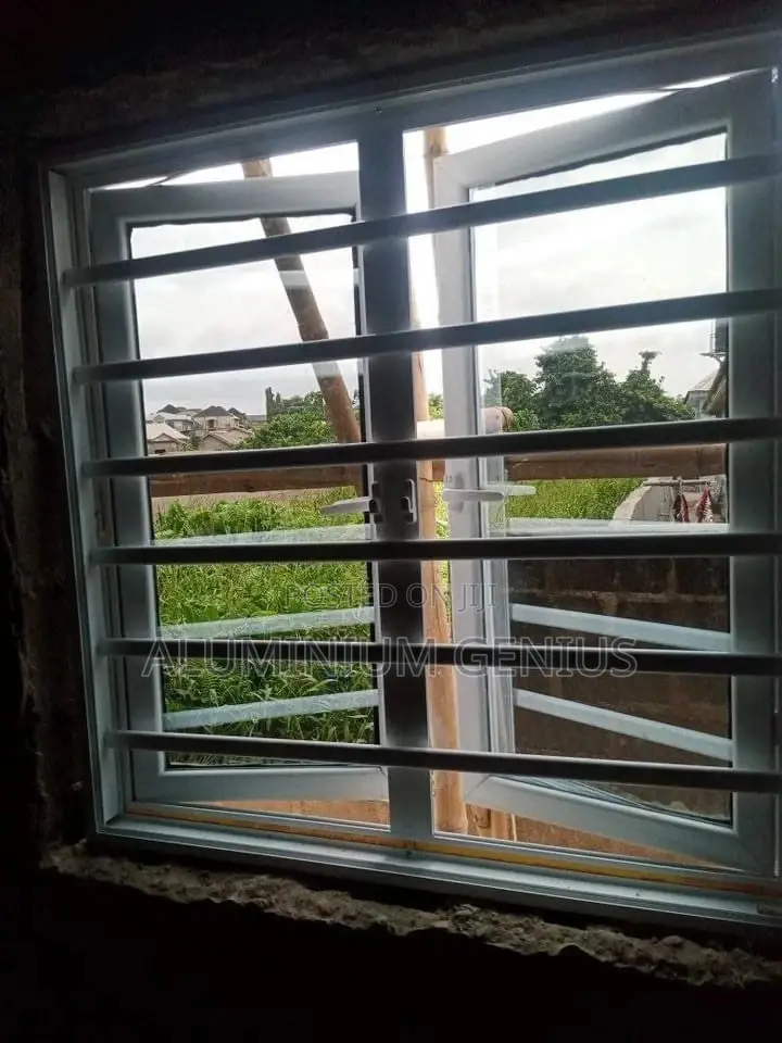White Casement Window With Burglary and Net