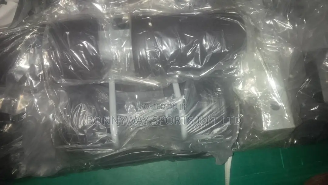 The Young Situp Bench With a Pair of Dumbells Nd Rope