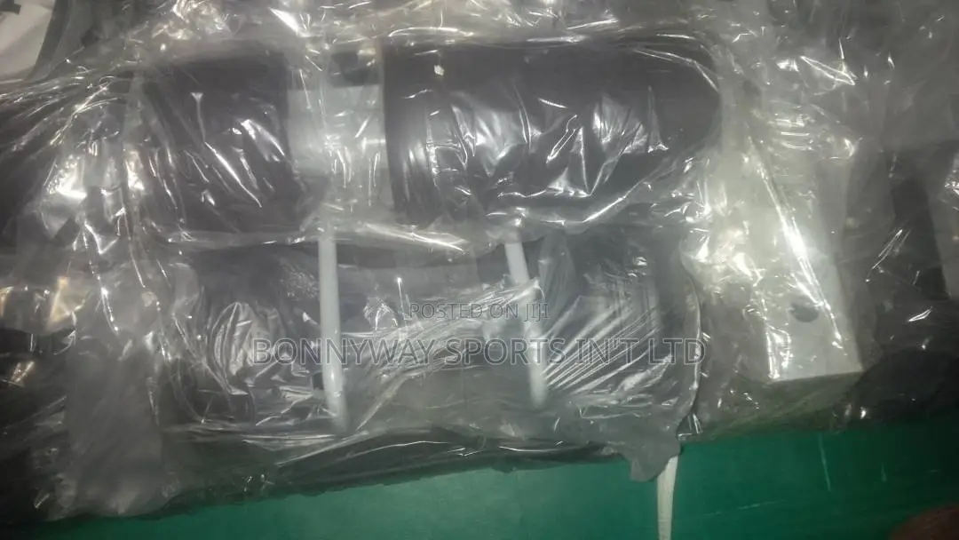 The Young Situp Bench With a Pair of Dumbells Nd Rope