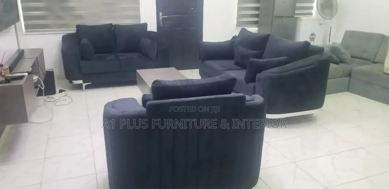 A Curvy 3,2,1 Sofa Set With A Fabric Finish + Center Table.