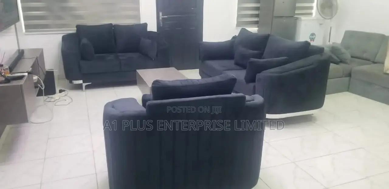 A Curvy 3,2,1 Sofa Set With A Fabric Finish + Center Table.