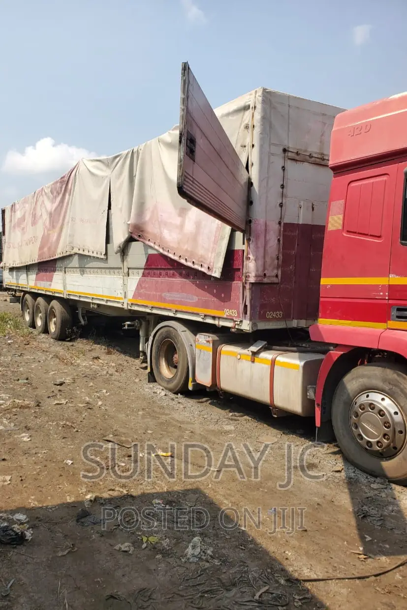 Tokunbo 60tons 40feet Flatbed Triple Axle Six Jumbo Tyres
