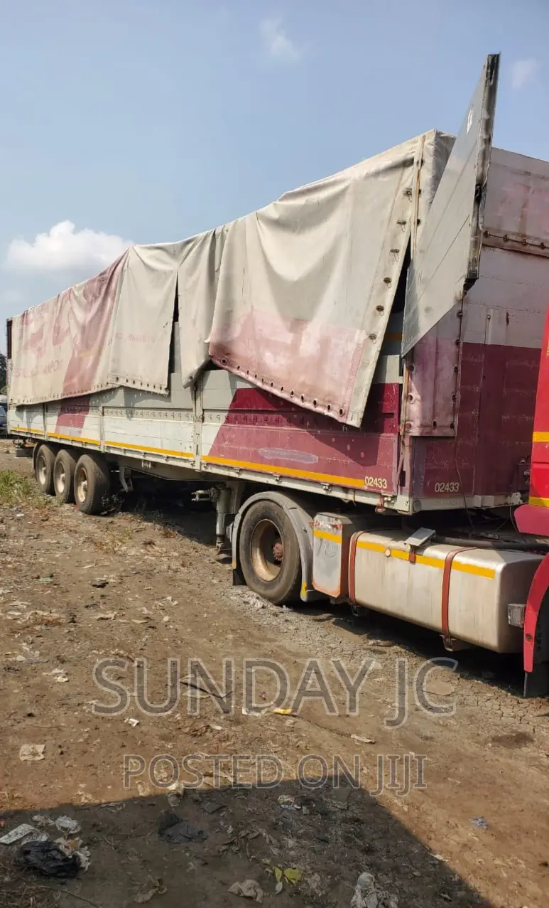 Tokunbo 60tons 40feet Flatbed Triple Axle Six Jumbo Tyres