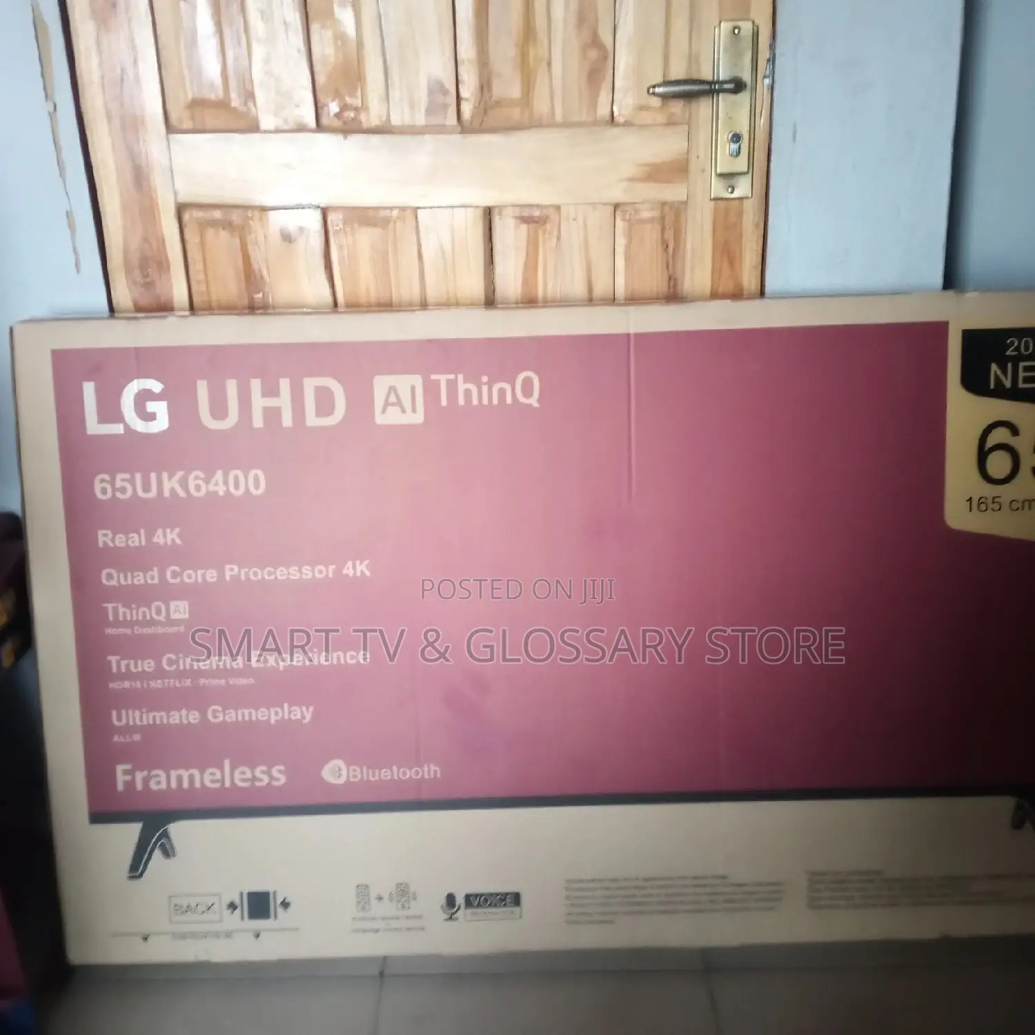 65inches LG Smart TV With Building Showcasing Apps