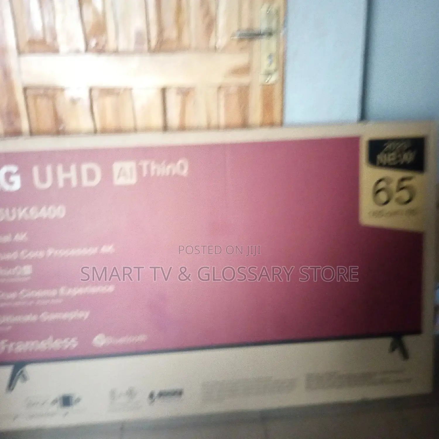 65inches LG Smart TV With Building Showcasing Apps