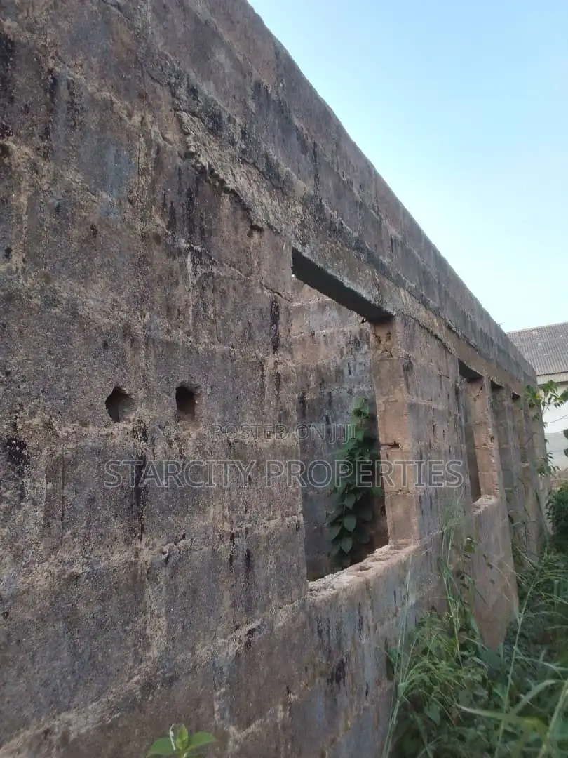 Half Plot of Land in Pankisa Agric With Three Bedroom on It