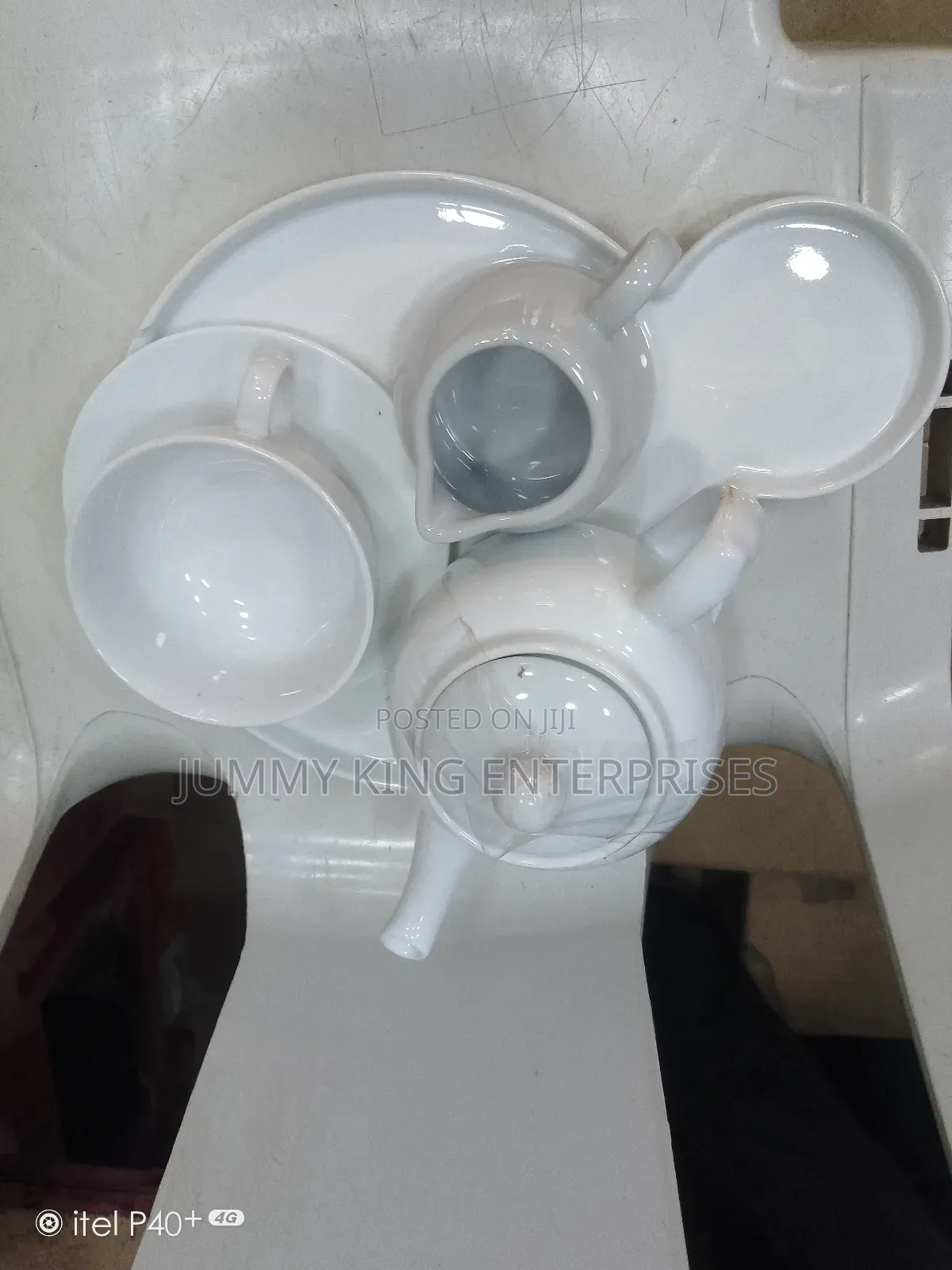 Sets of Tea Cups, Saucers and Kettle