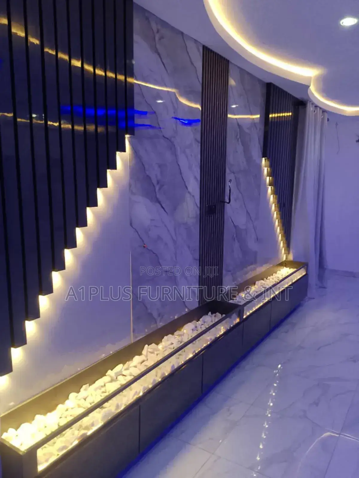 Wall Cladding With Spotlights and Stone Accents