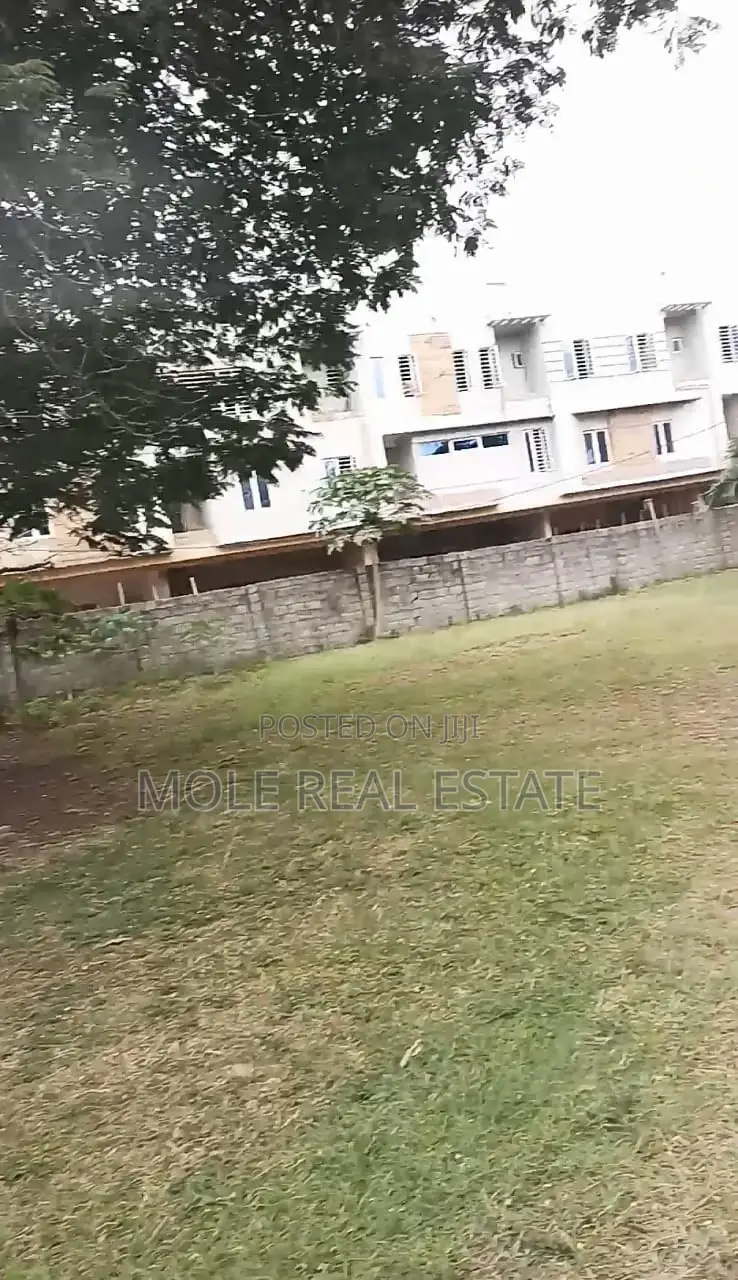 Half Plot of Dry Land Fenced Gated by Bakare Estate