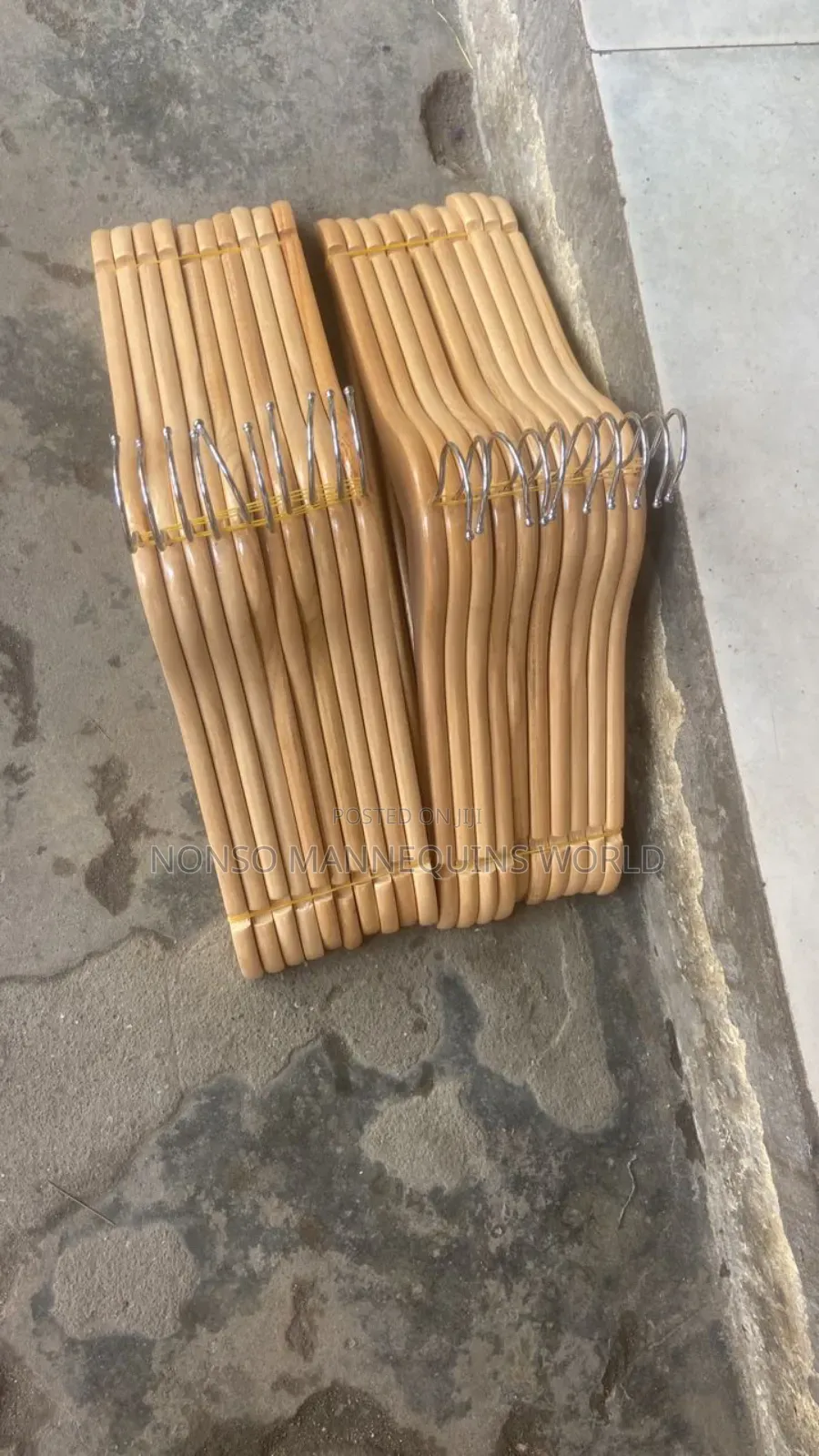 Packs of Neat Wooden Clothes Hangers